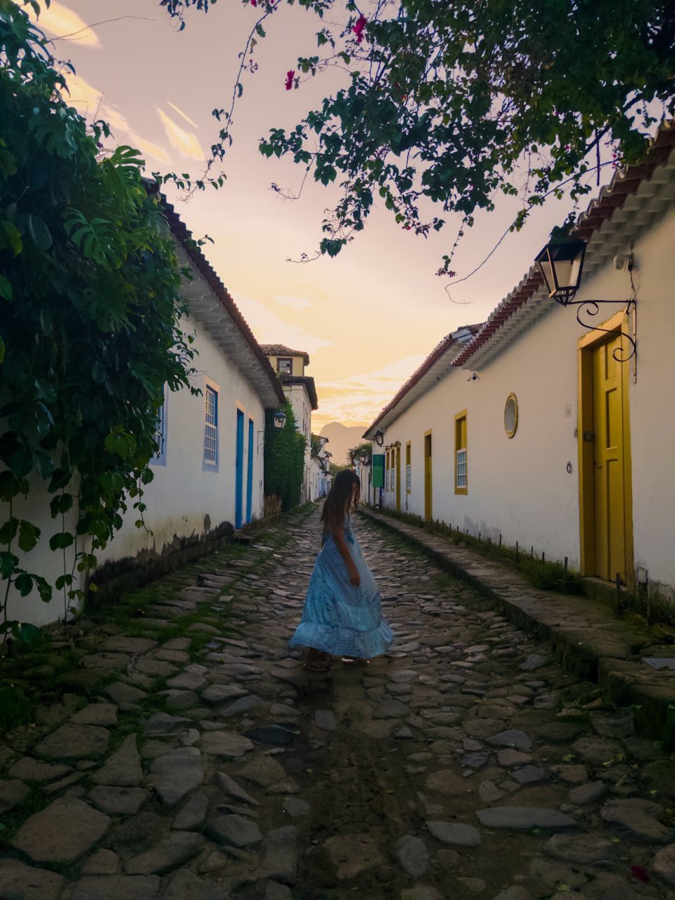 Young traveller enjoying a Paraty walking tour at sunset on tour with TruTravels
