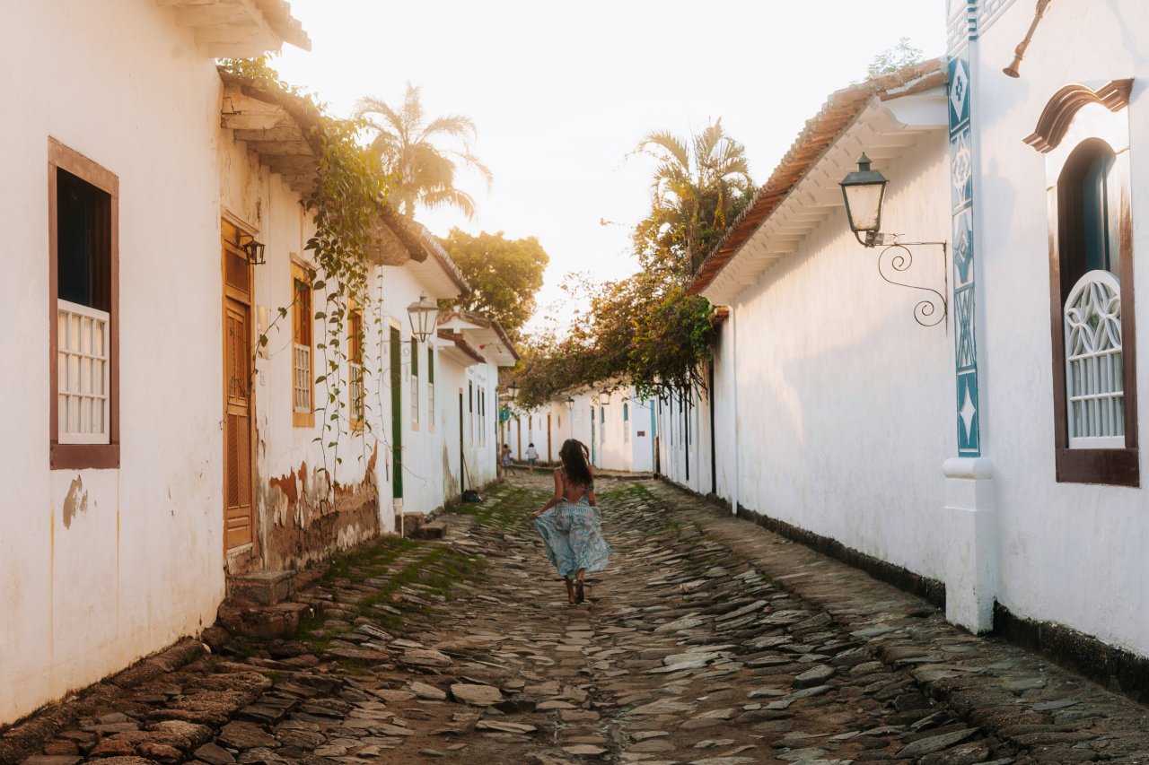 Young traveller enjoying a Paraty walking tour at sunset in Brazil on tour with TruTravels