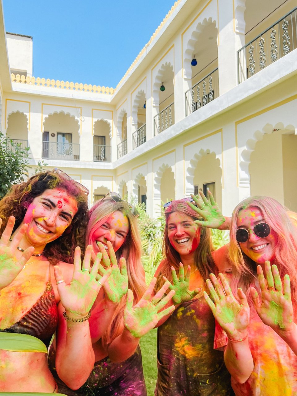 A group of solo travellers enjoying the Holi festival in Jaipur on tour with TruTravels